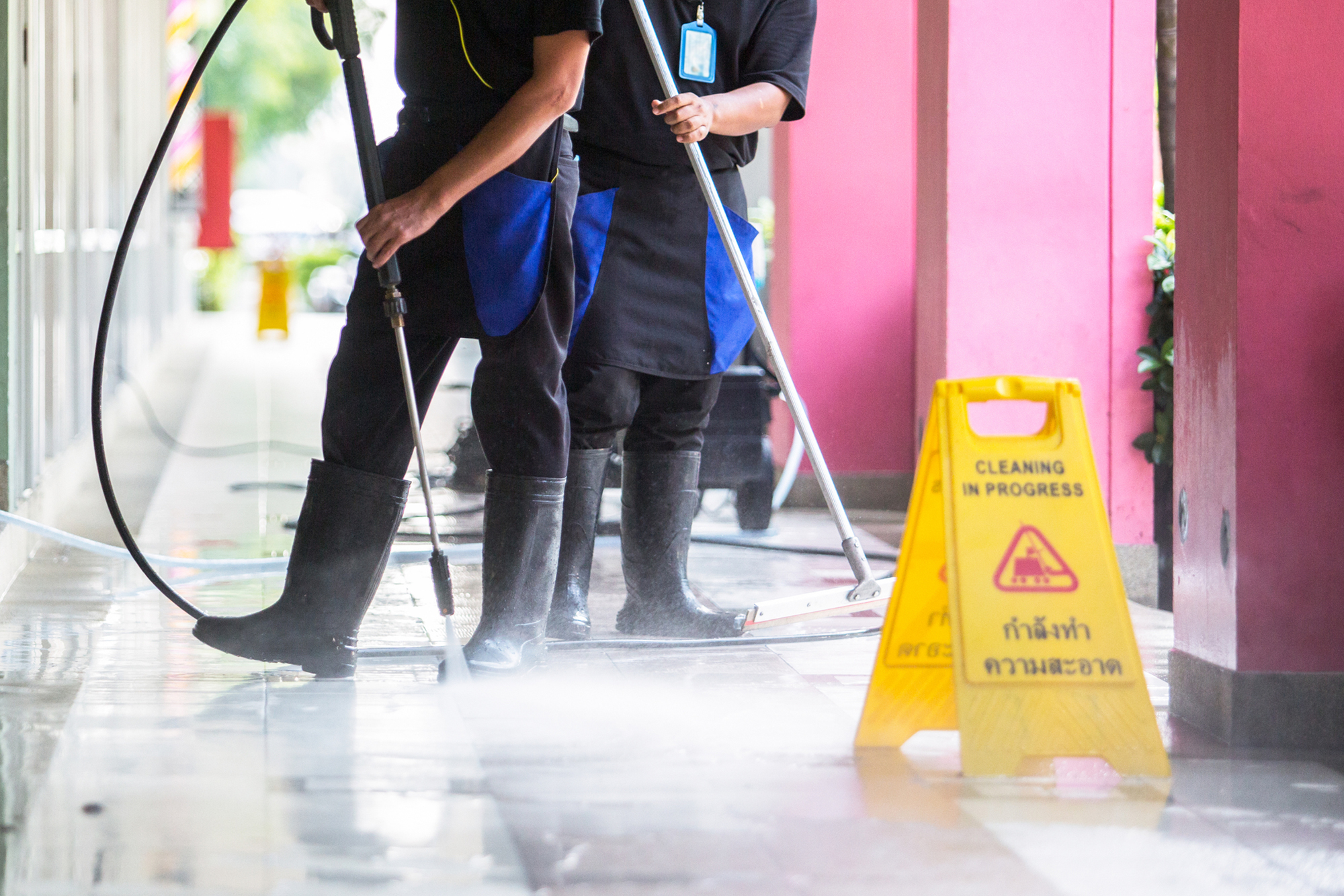 Workers Cleaning The Floor